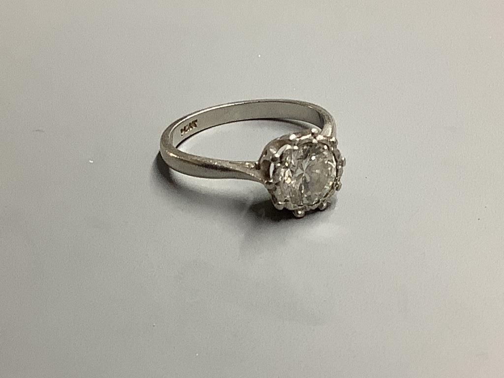 A white metal (stamped platinum) and solitaire diamond ring, size N, gross weight 4.5 g